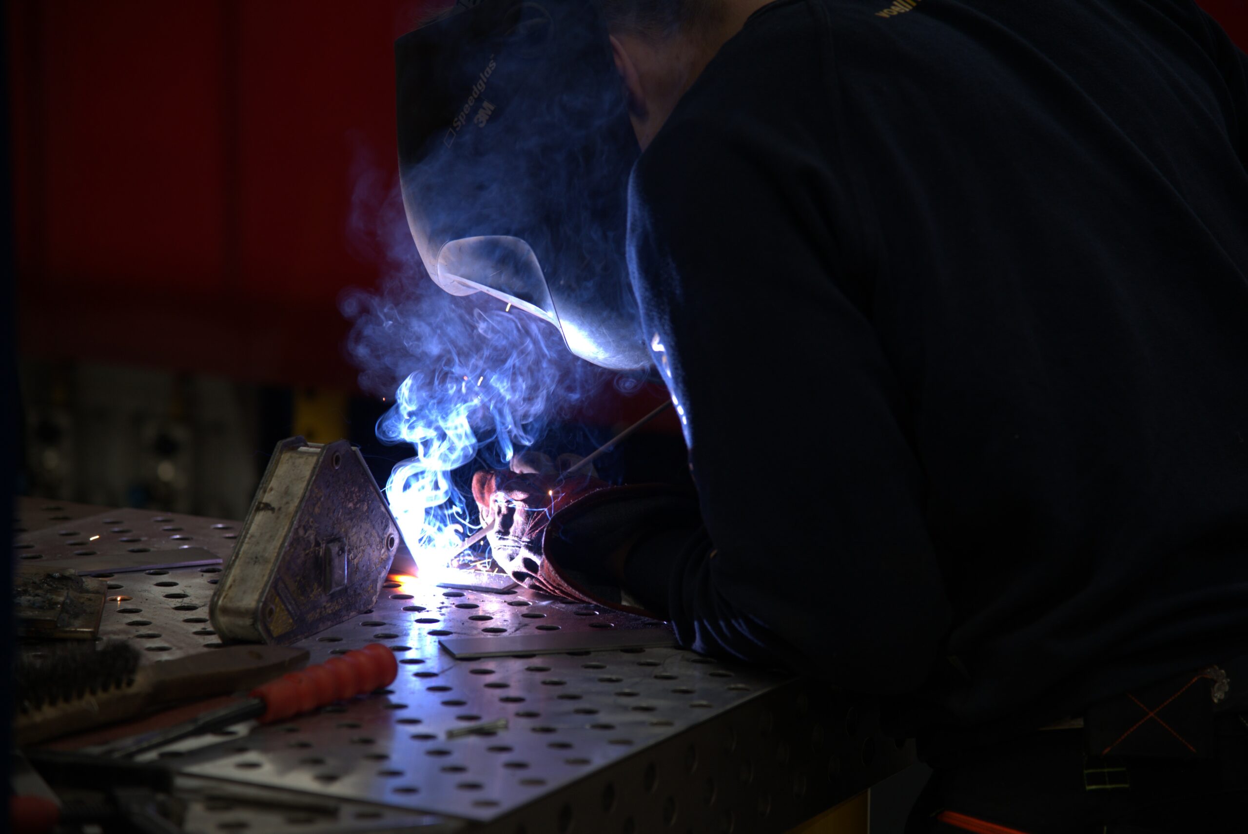 person holding tool during daytime